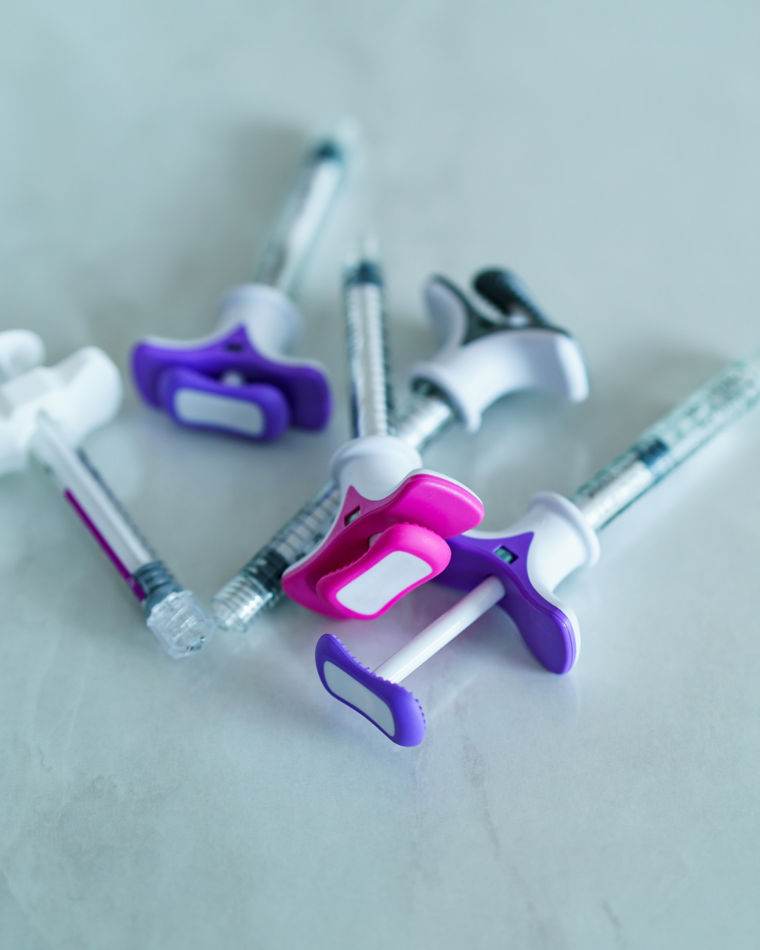 Minimal line art of a sculpted Caucasian profile highlighting precise dermal filler contouring.